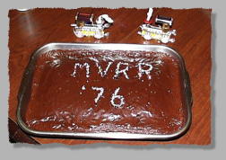 The 1976/Year 2000 celebration cake and party favors.
